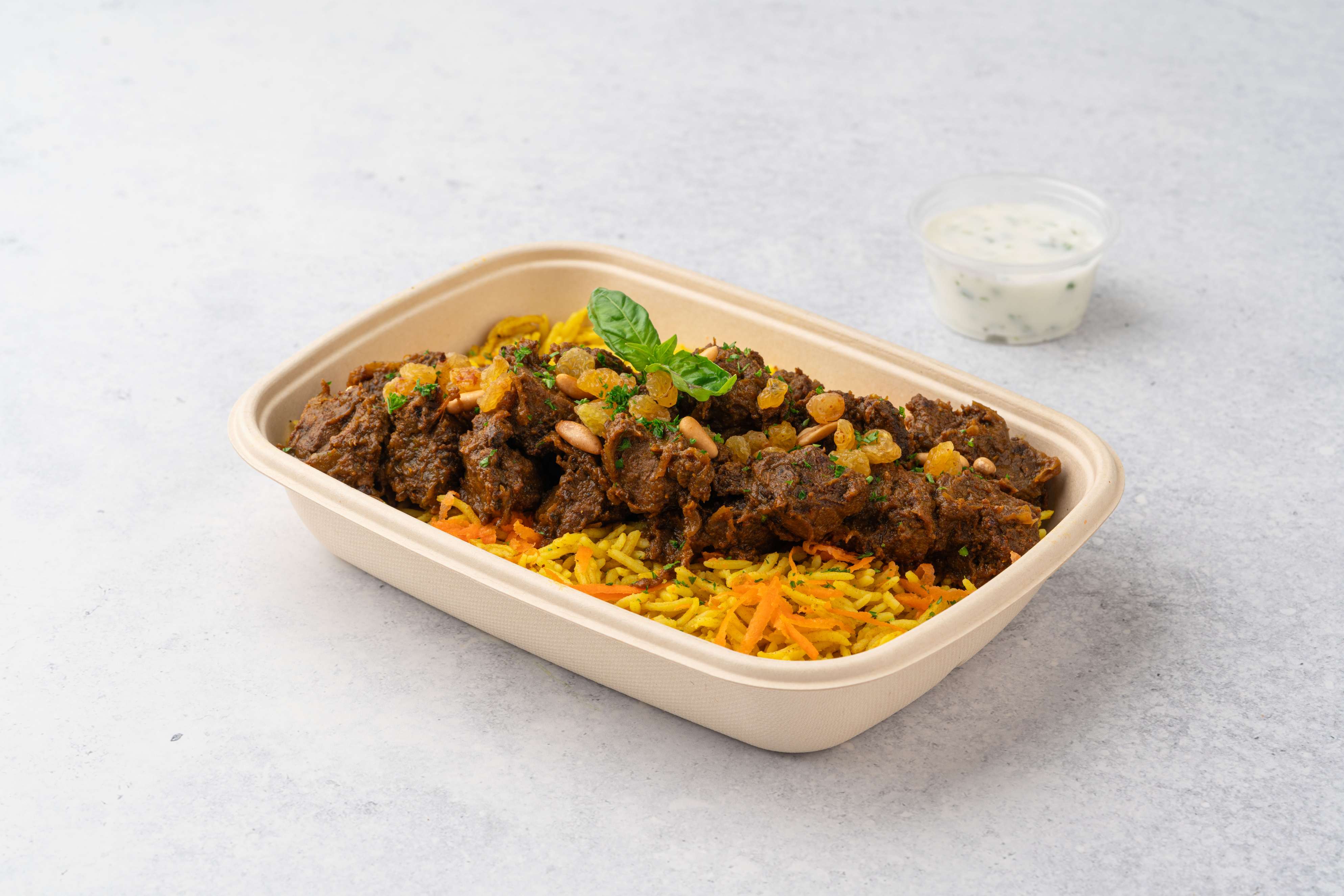 Beef Bukhari Rice With Pine Nuts Raisins And Carrot And Cucumber Yogurt Sauce